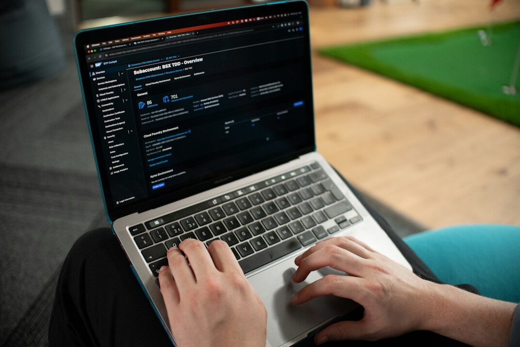 person learning coding on laptop
