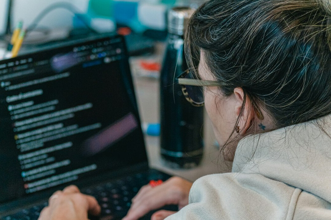 person learning programming on laptop