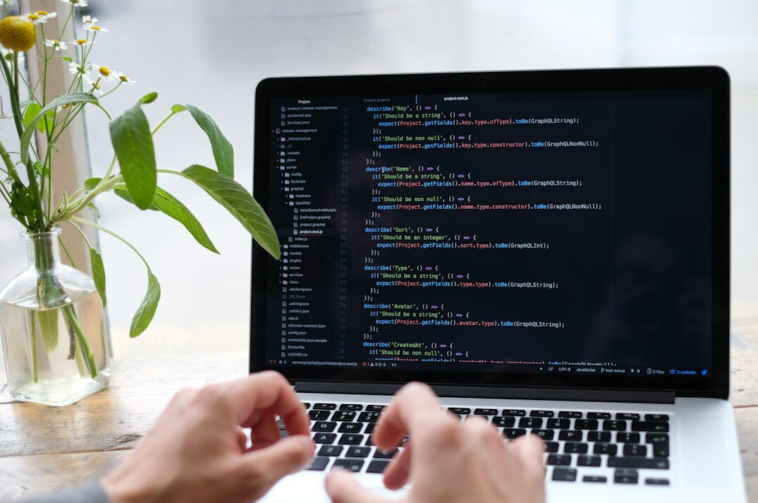 person learning coding on laptop