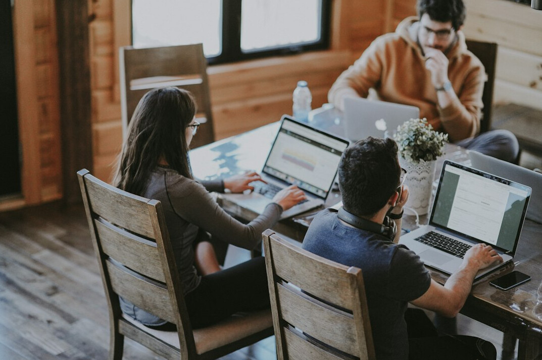group of friends coding together